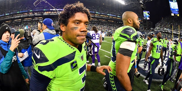 Russell Wilson and KJ Wright after a match