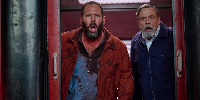 Bert Kreischer and Mark Hamilly in a scene from The Machine