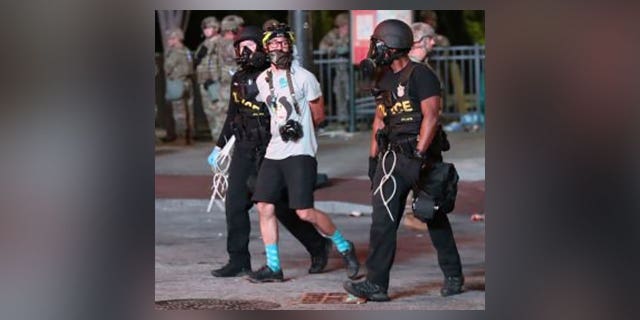 Sharif Hassan getting arrested