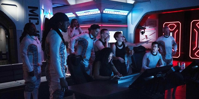 Tallulah Willis and Adam Rippon wear black tank tops while manning deck in Mars mission