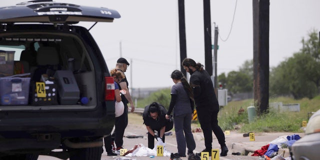 investigators at crash scene