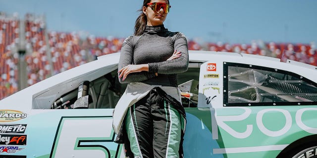 Toni Breidinger poses on her car