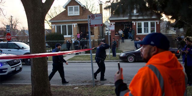 Chicago police walking through a crime scene.