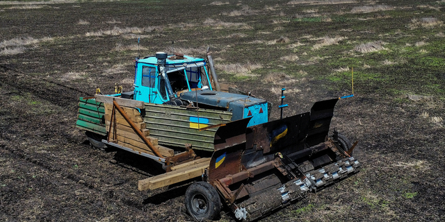 Ukraine tractor scans for Russian mines