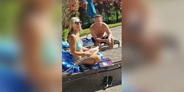Lori Vallow sitting poolside in a blue bikini next to Chad Daybell
