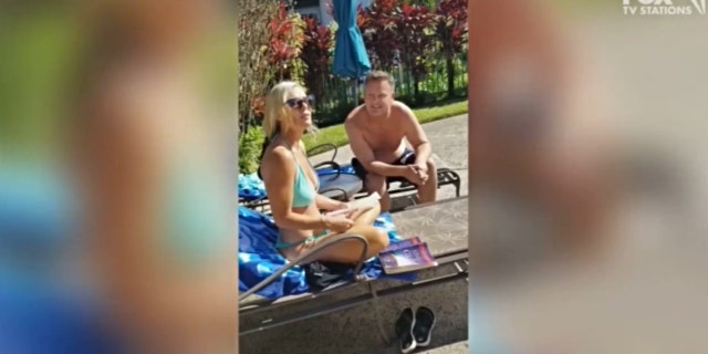 Lori Vallow sitting poolside in a blue bikini next to Chad Daybell