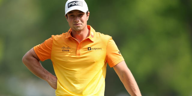 Viktor Hovland wears green