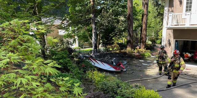 firefighters working scene of crash