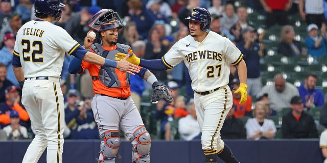 Willy Adames celebrates with his teammates