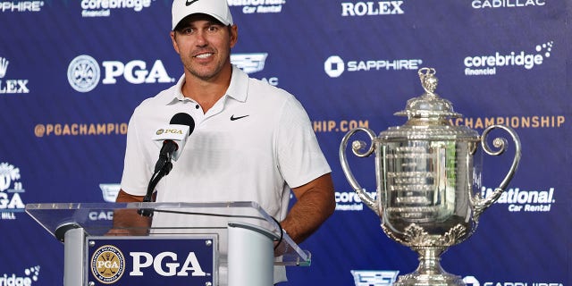 Brooks Koepka with the trophy
