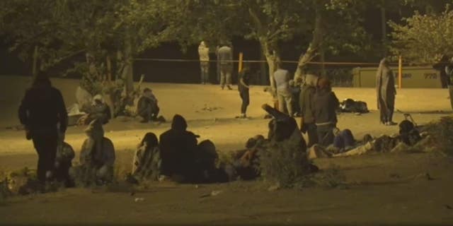Groups of migrants at border