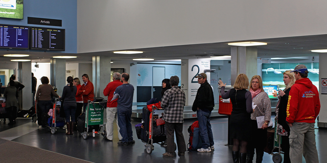 line of passengers at Auckland Airport