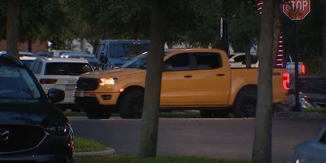 Cars in shopping plaza lot