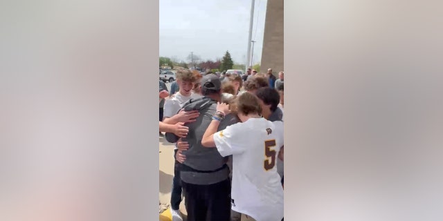 baseball team hugging BH