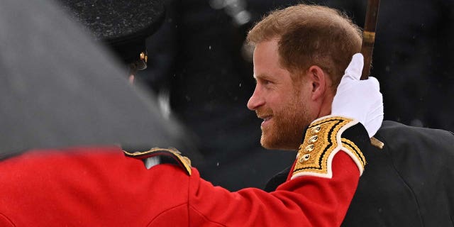 Prince Harry, Duke of Sussex, walks outside Westminster Abbey ahead of Britains King Charles coronation