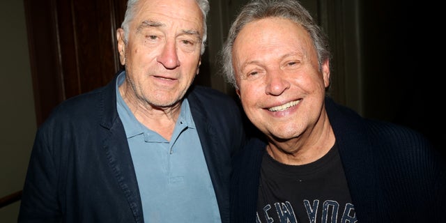 Robert De Niro poses for a photo with friend and former costar Billy Crystal.