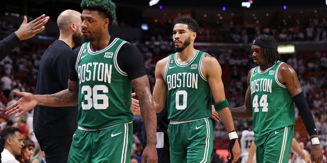 Marcus Smart, Jayson Tatum and Robert Williams III during the game