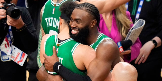 Derrick White and Jaylen Brown embrace