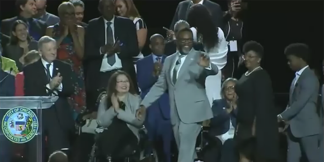 Chicago's new mayor Brandon Johnson waves to the crowd