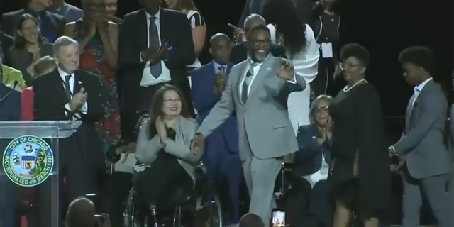 Chicago's new mayor Brandon Johnson waves to the crowd