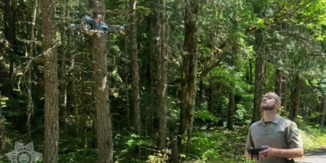 searcher using drone near Clackamas River