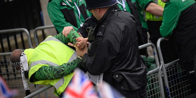 Police arresting a protester