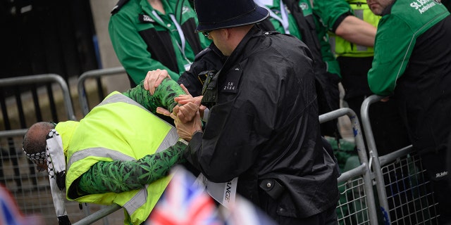 Police arresting a protester