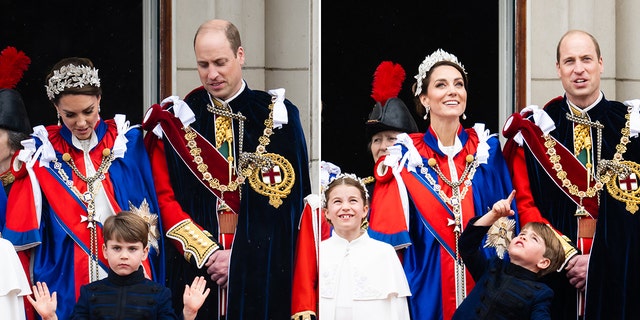 Prince Louis waves on the balcony in front of his mother Kate Middleton in red and a large stone tiara and Prince William in black adorned with a sash and chain split Prince Louis points up to the sky