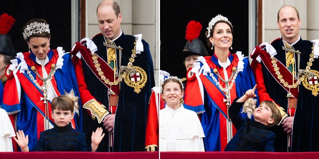 Prince Louis waves on the balcony in front of his mother Kate Middleton in red and a large stone tiara and Prince William in black adorned with a sash and chain split Prince Louis points up to the sky