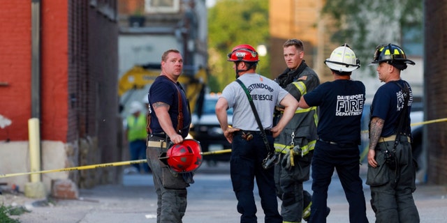 Crews at the scene of a Davenport building collapse