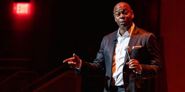 dave chappelle on stage during comedy show