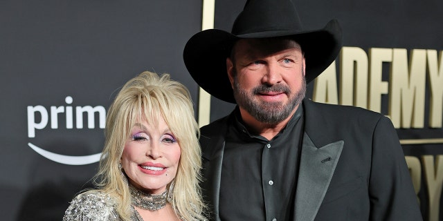 Dolly Parton and Garth Brooks on the 2023 ACM red carpet