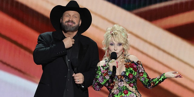 Dolly Parton wears glittering dress with Garth Brooks on stage at country music awards