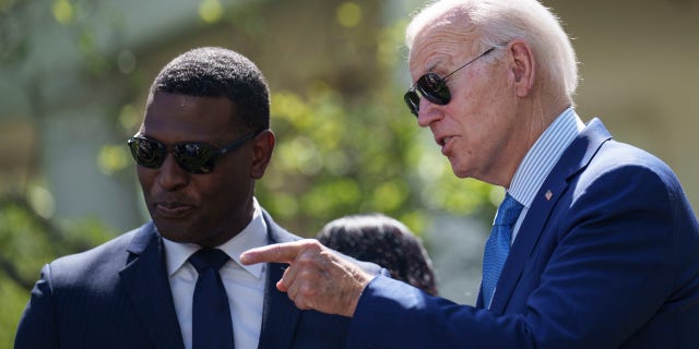 US President Joe Biden talks to EPA Administrator Michael Regan