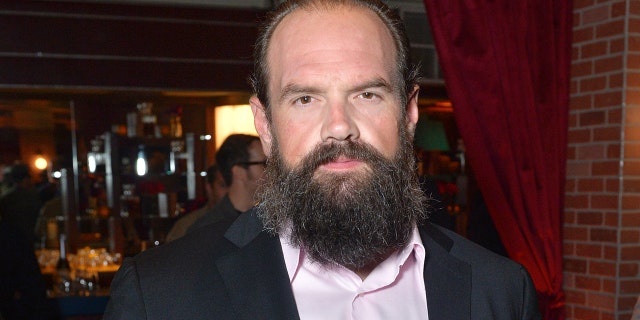 Ethan Suplee wears a grey suit with a pink shirt at Hollywood event