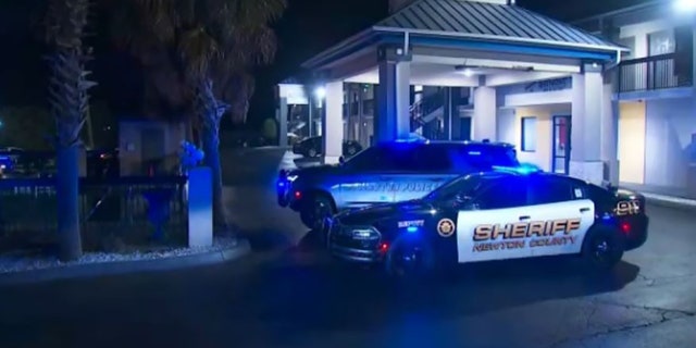 police vehicles at motel scene