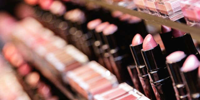 Lipstick testers displayed in a store.