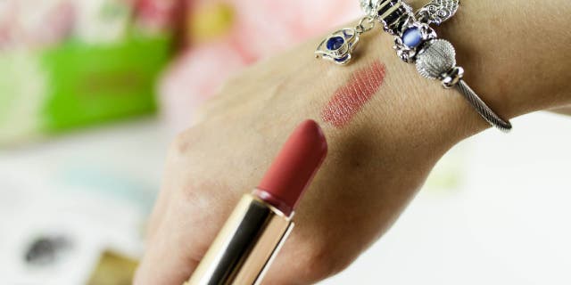 Lipstick swatch on hand.