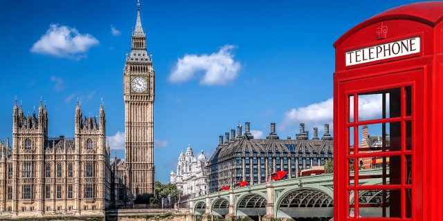 Houses of Parliament in background, red phone box at foreground right