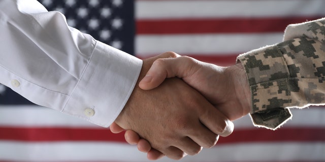 soldier shaking hands