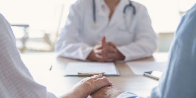 Couple meeting with doctor