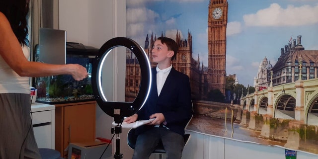 British school boy news anchor