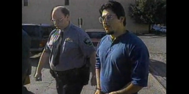 Raul Meza walking in handcuffs in the 1980s