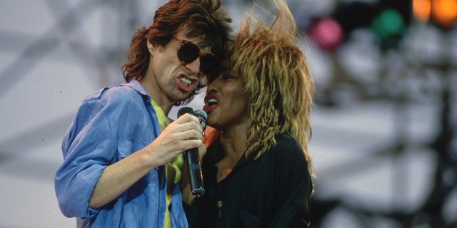 Mick Jagger and Tina Turner singing