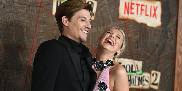 Jake Bongiovi laughing with Millie Bobby Brown