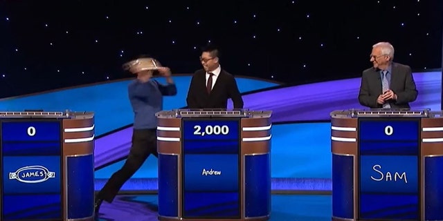 'Jeopardy! Masters' player James Holzhauer takes swipe at fellow contestant Andrew He with championship belt  at george magazine
