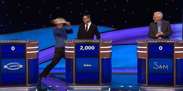 James Holzhauer pretending to hit Andrew He