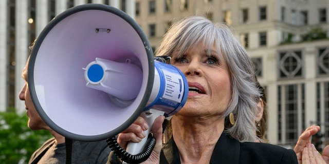 Jane Fonda with bullhorn at protest