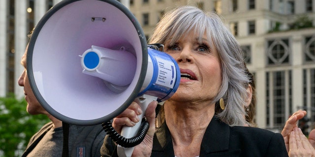 Jane Fonda with bullhorn at protest