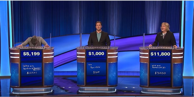 Three contestants in playing Jeopardy.